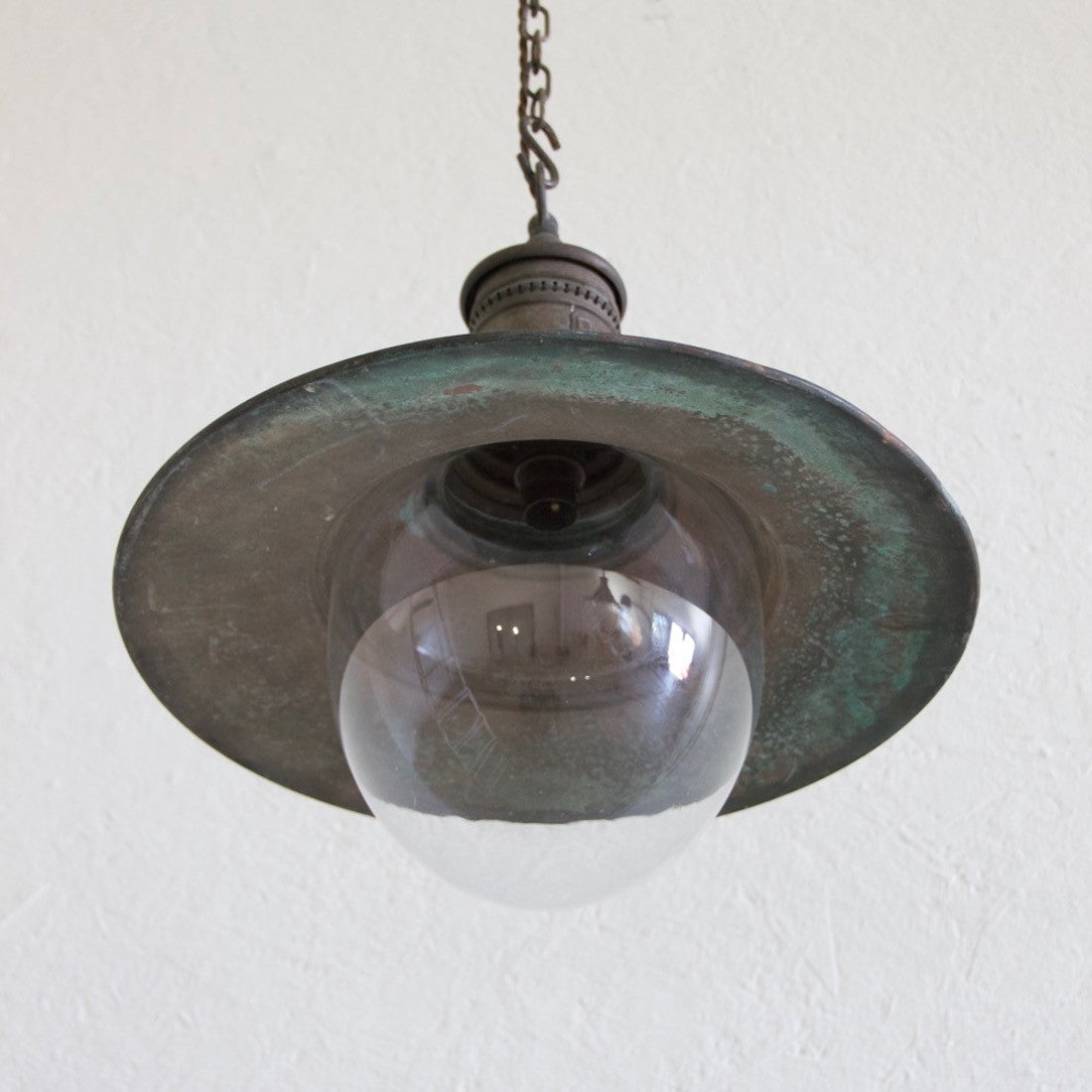 A pair of copper pendant lights
