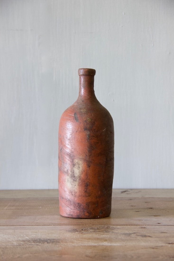 A set of ten clay bottles