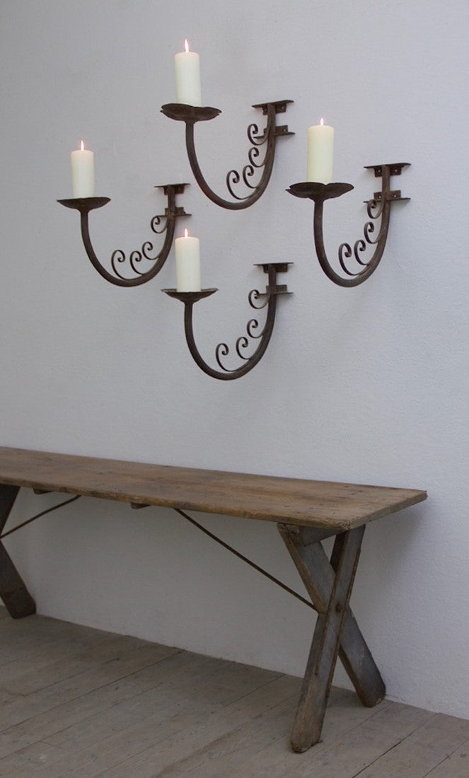 A set of 4 iron wall prickets