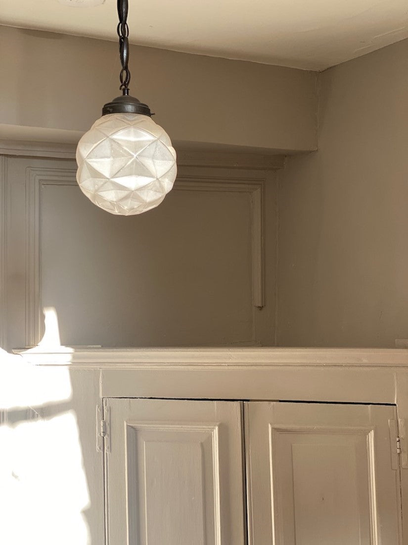 A geometric globe pendant light