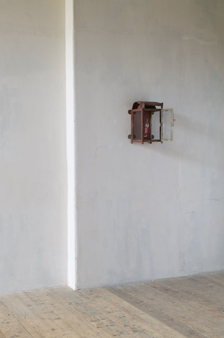 A primitive tole wall lantern