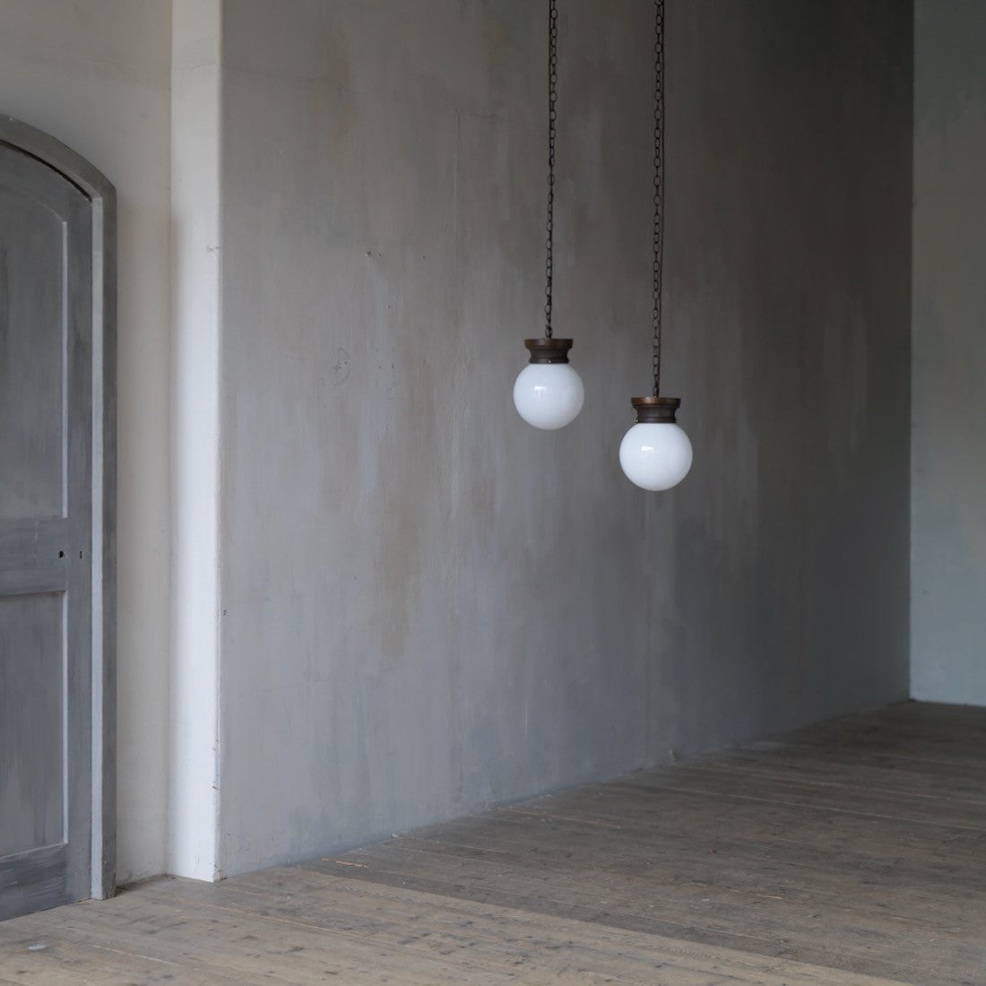 A pair of globe pendant lights