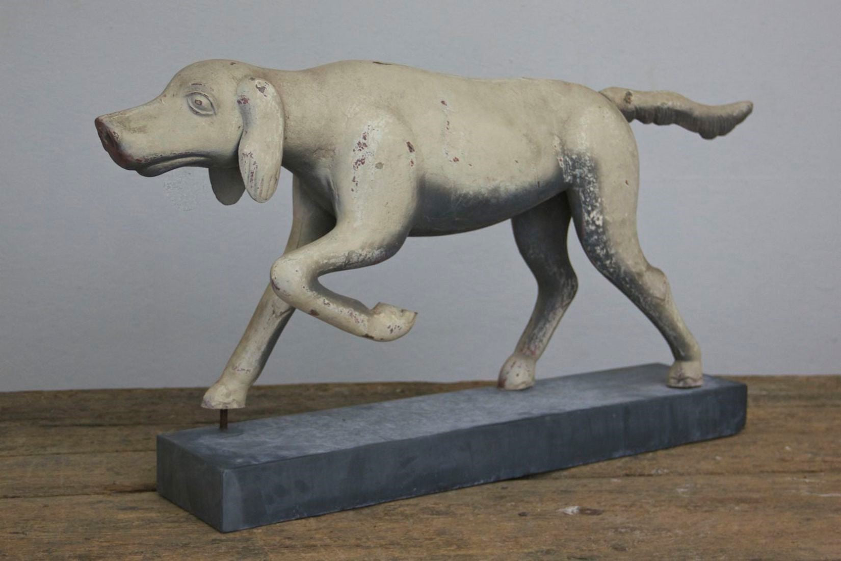 A primitive tin hunting dog