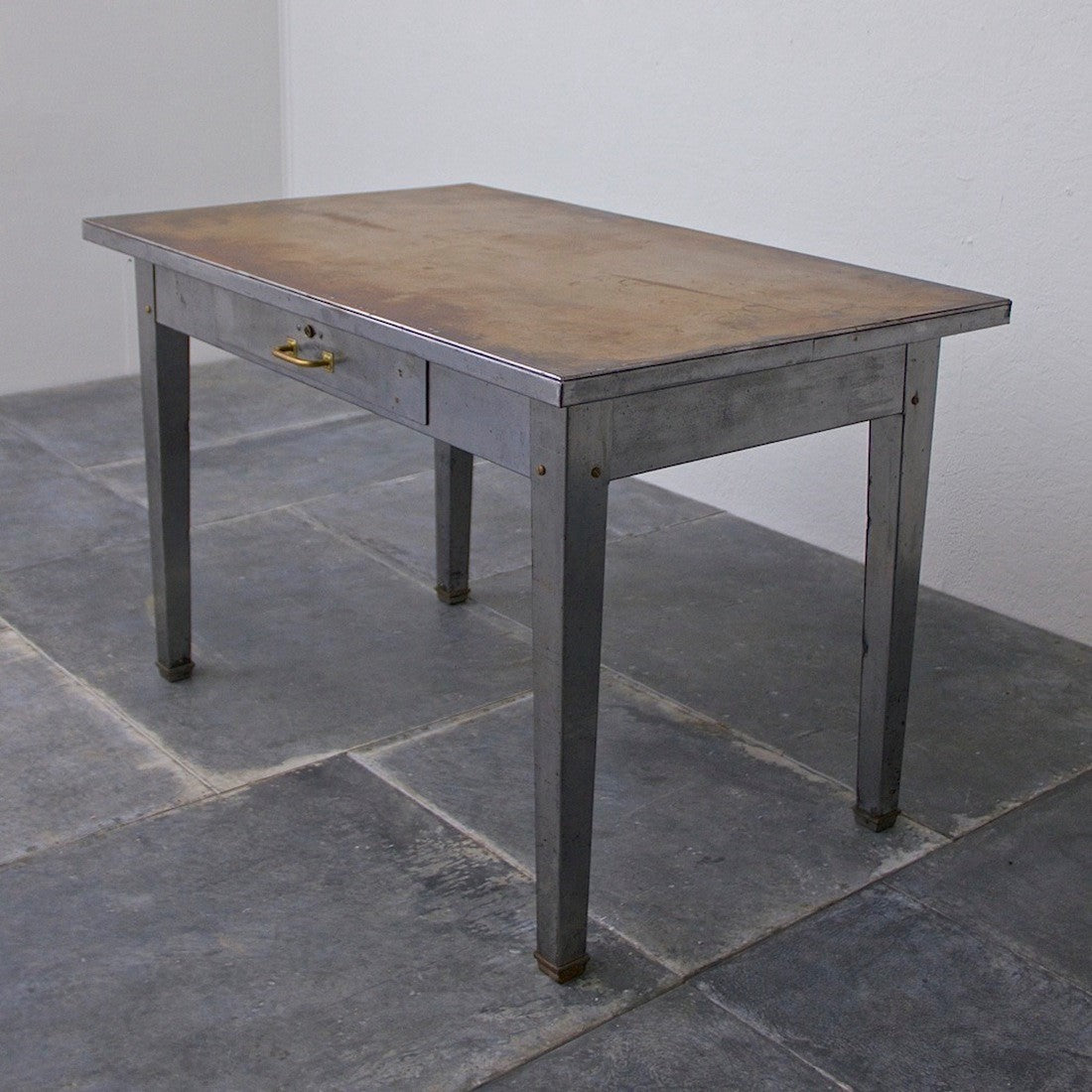 A 1940's brass and steel desk
