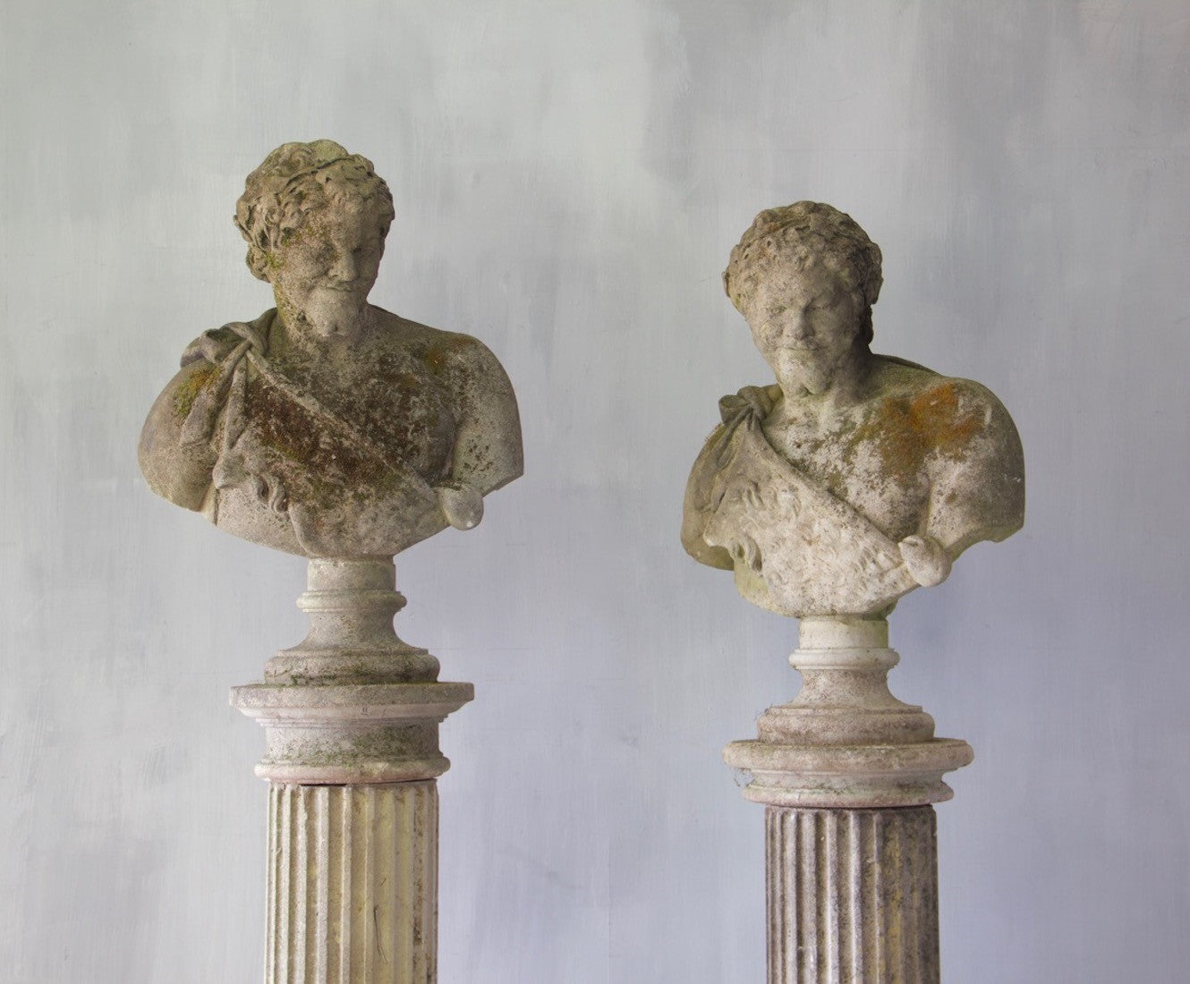 Two classical busts on columns