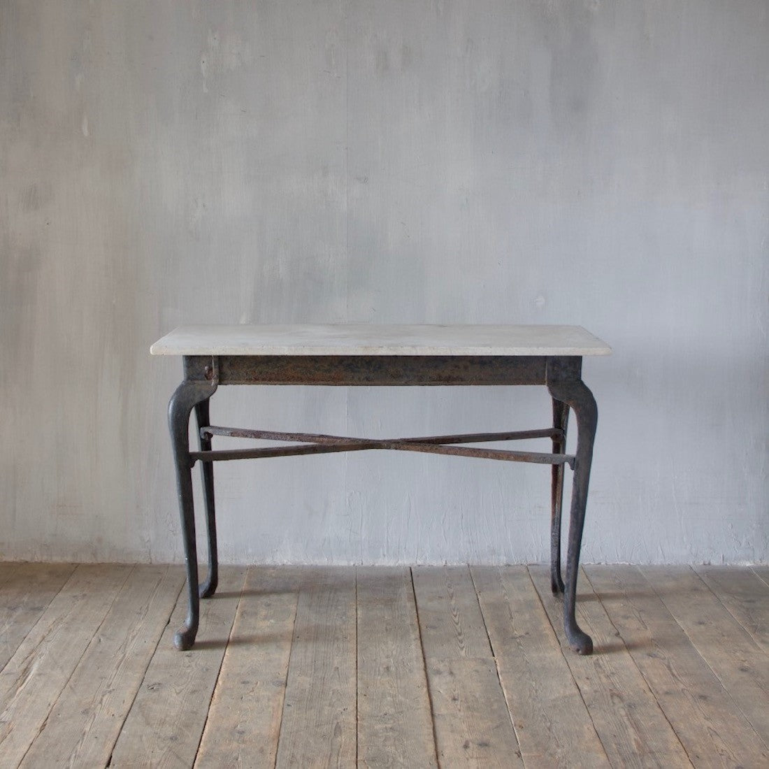 An iron and marble console table