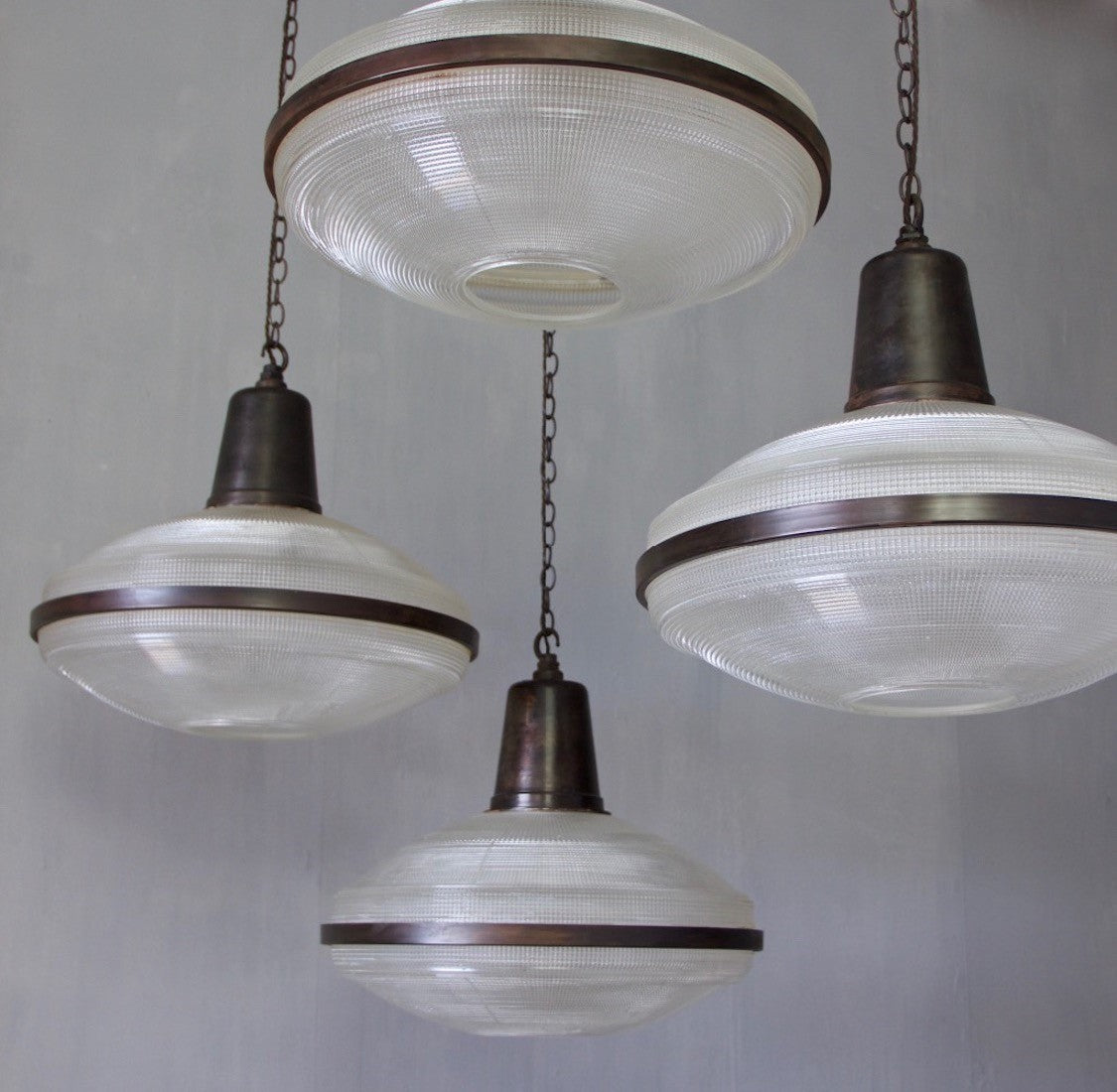 A set of 5 large Holophane pendant lights