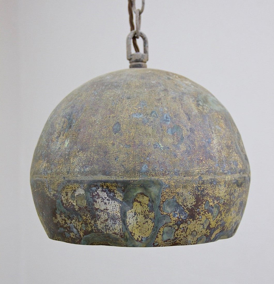 A set of three copper pendant lights