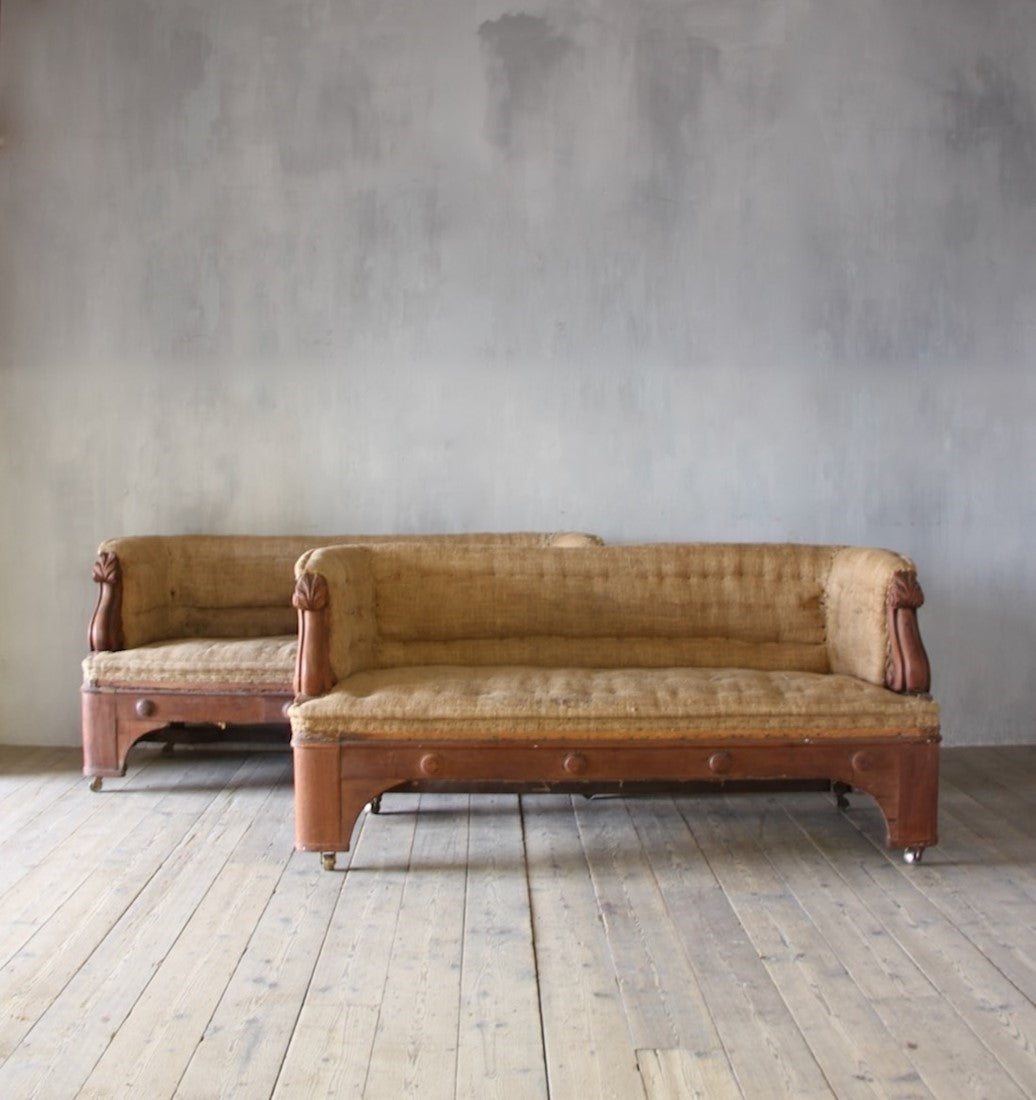 A pair of 19th century sofas from Penrhyn castle, Wales
