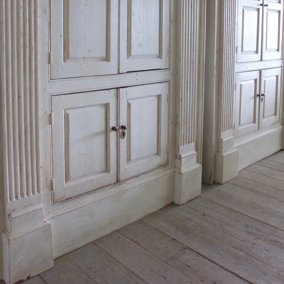 A pair of C18th cupboards