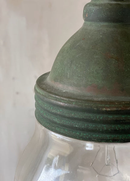 A small copper globe pendant light