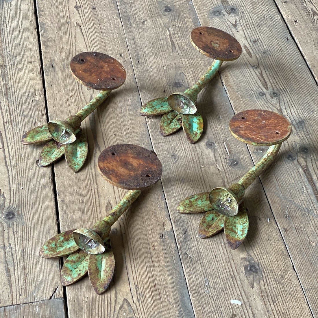 A set of four petal sconces
