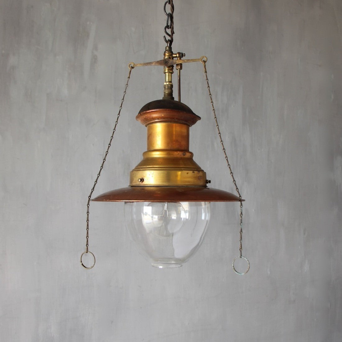 A set of three original gas pendant lights