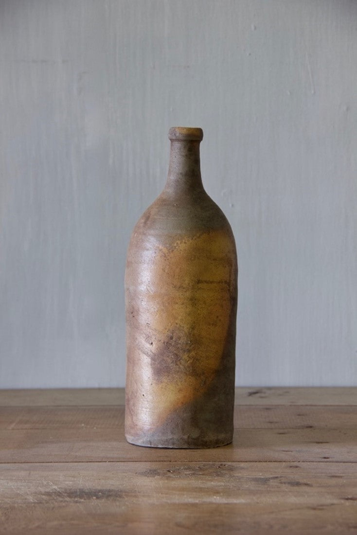 A set of ten clay bottles