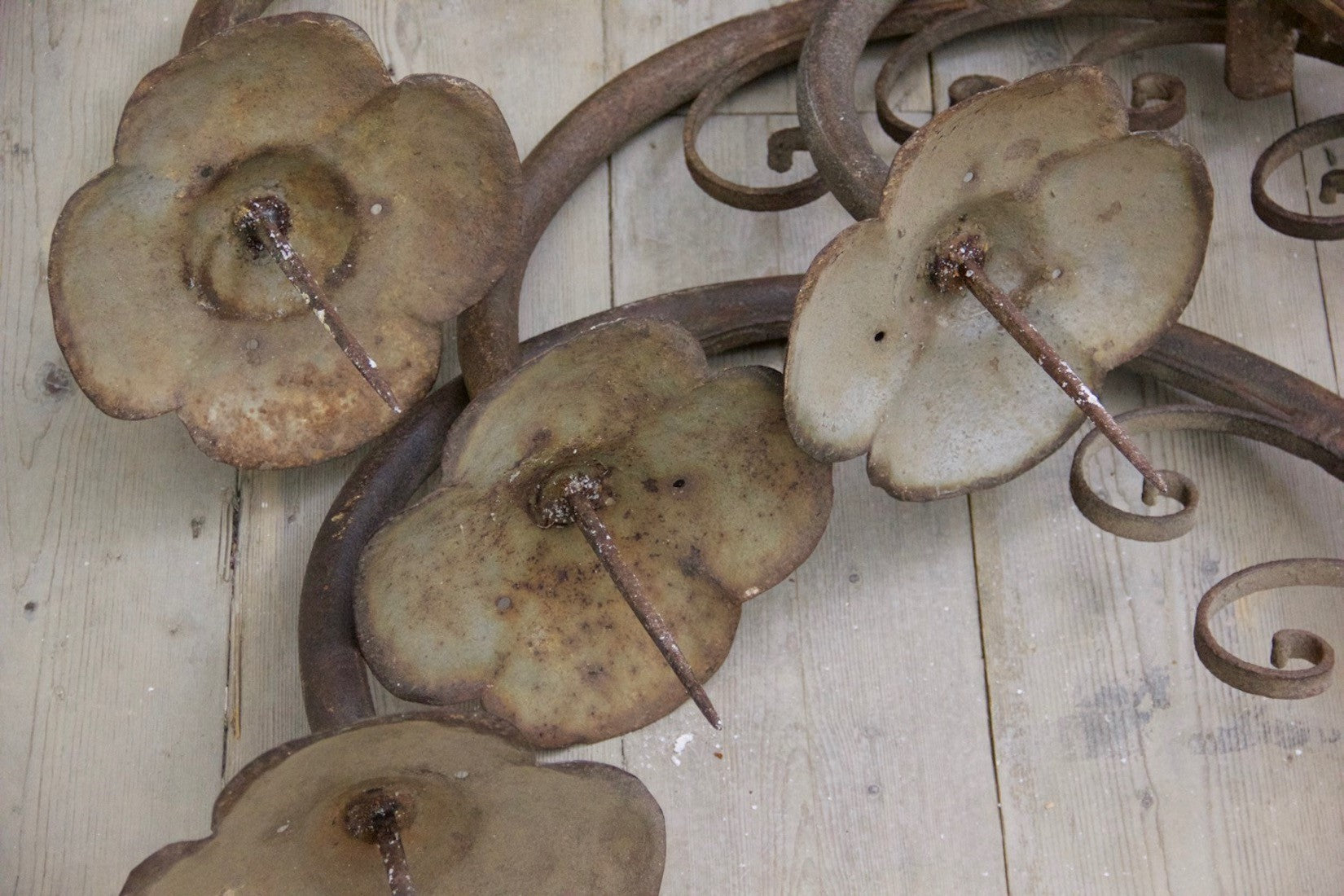 A set of 4 iron wall prickets
