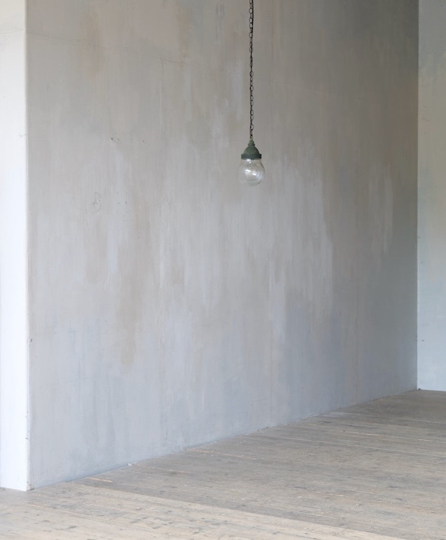 A small copper globe pendant light