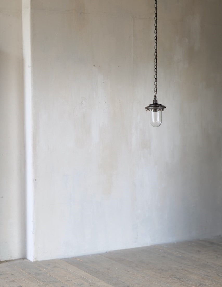 An industrial iron pendant light