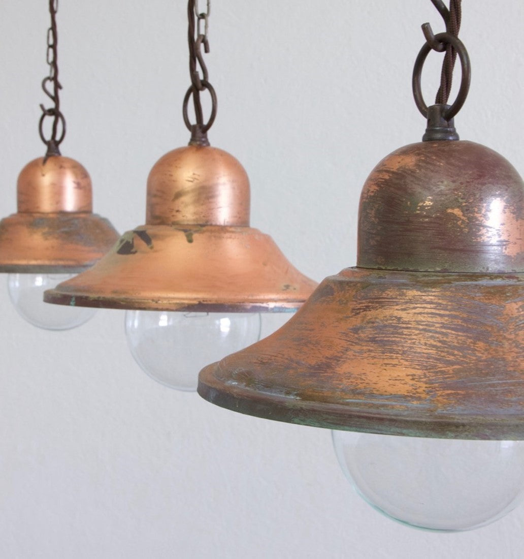 A set of 3 copper pendant lights