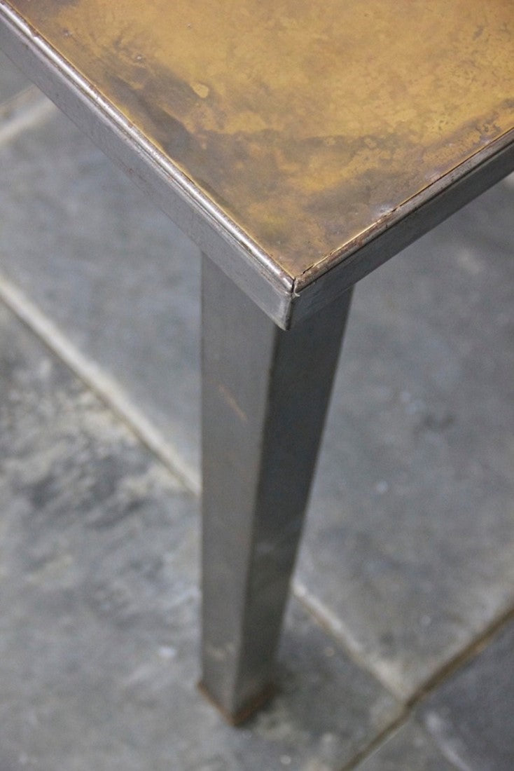 A 1940's brass and steel desk