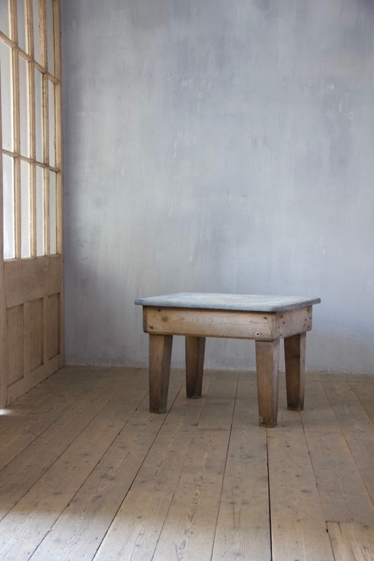 A primitive estate-made side table