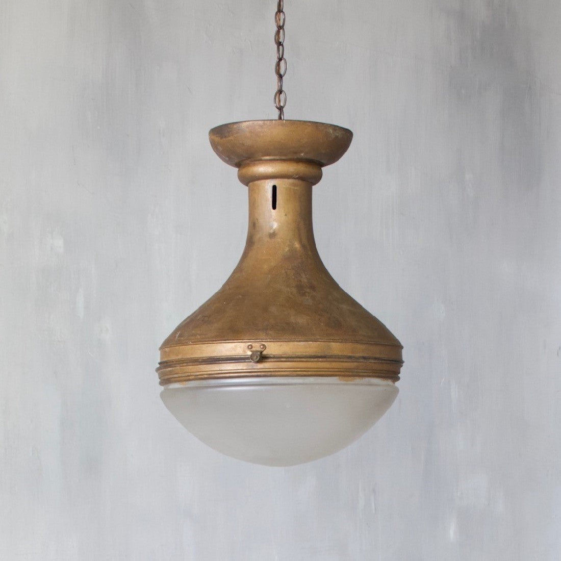 A spun copper pendant light