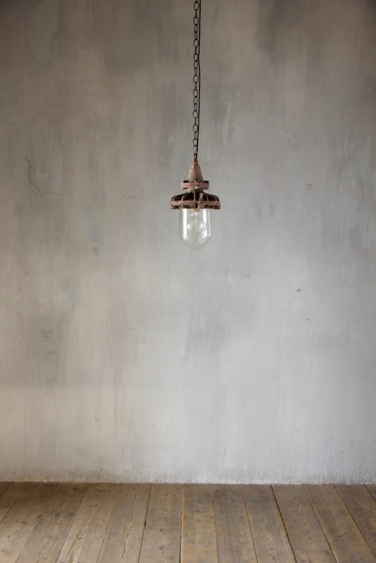 A set of three small industrial pendant lights