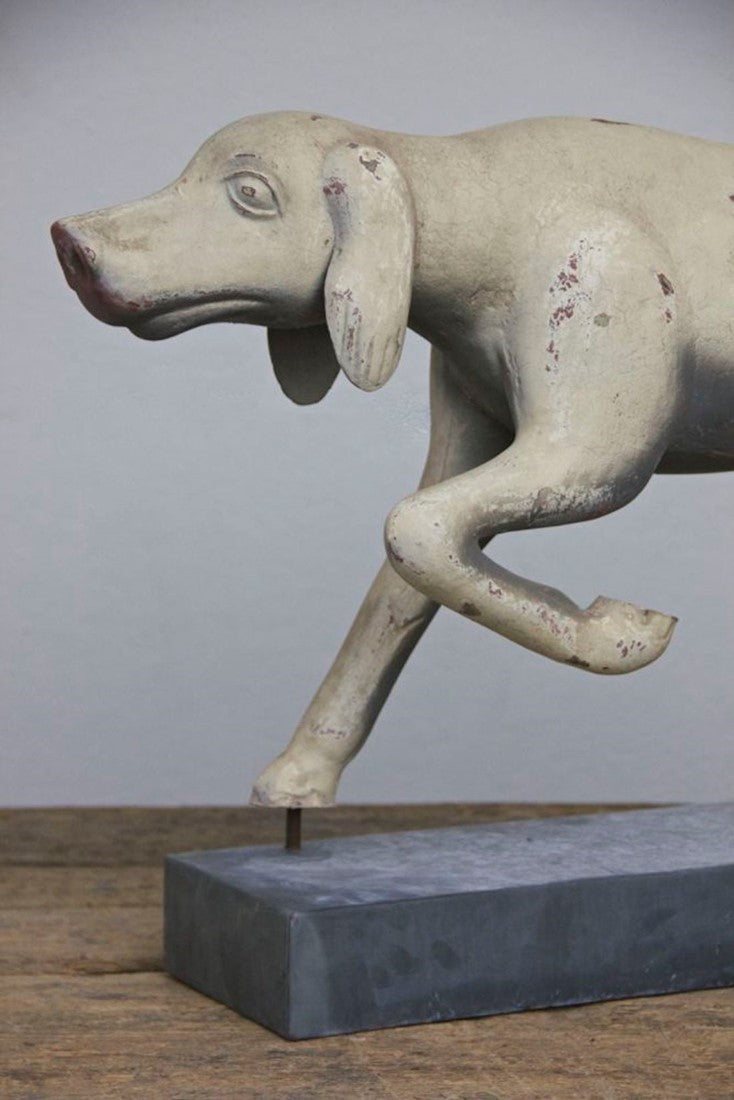 A primitive tin hunting dog