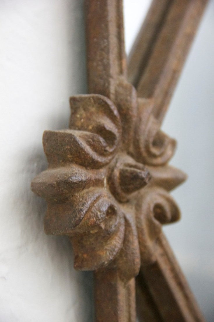 A C19th iron framed mirror.