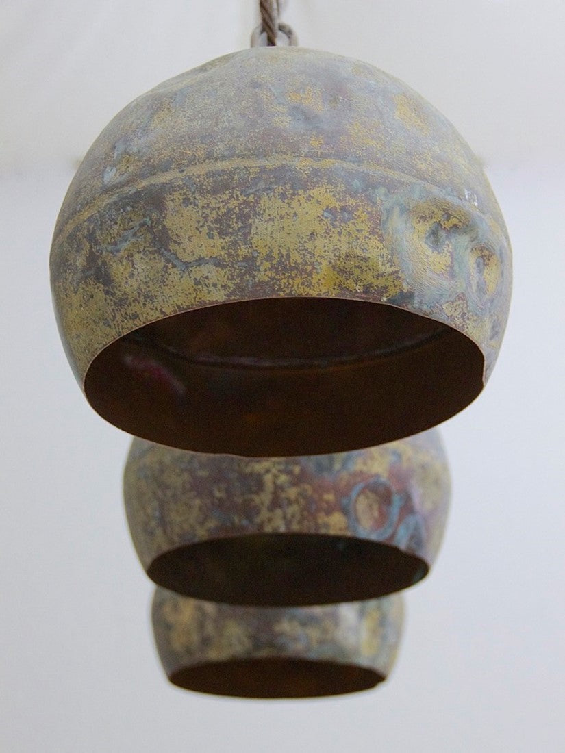 A set of three copper pendant lights