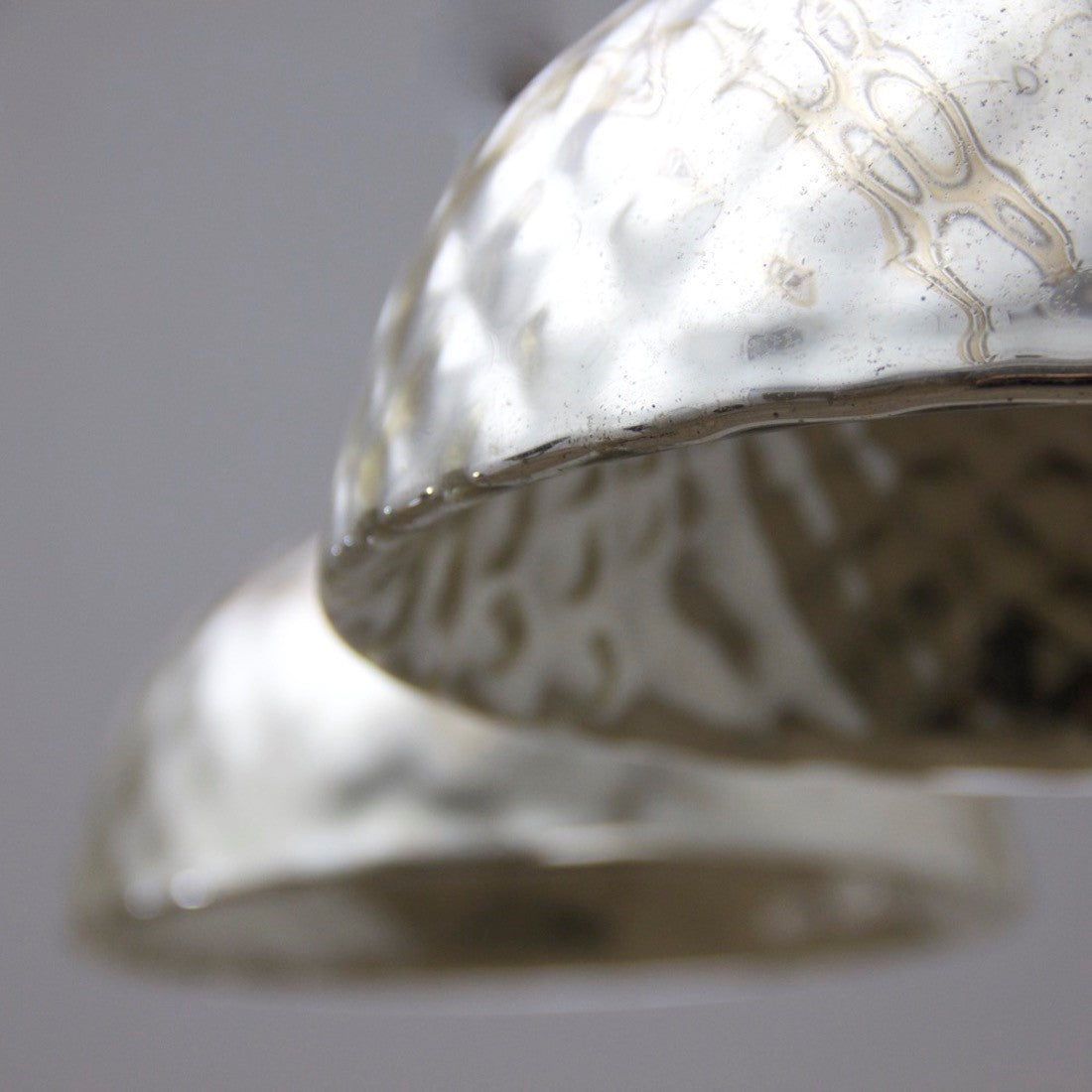 A pair of mercury glass pendant lights