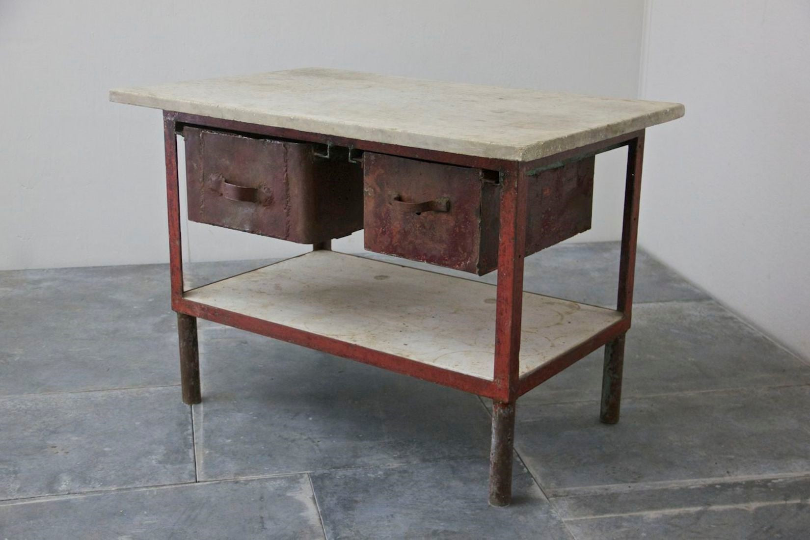 An early C20th iron and marble table
