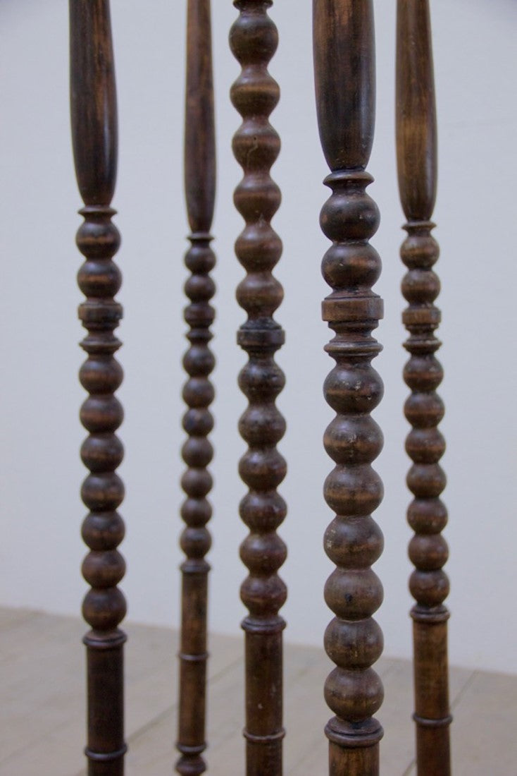 A collection of 5 ebonised hat stands