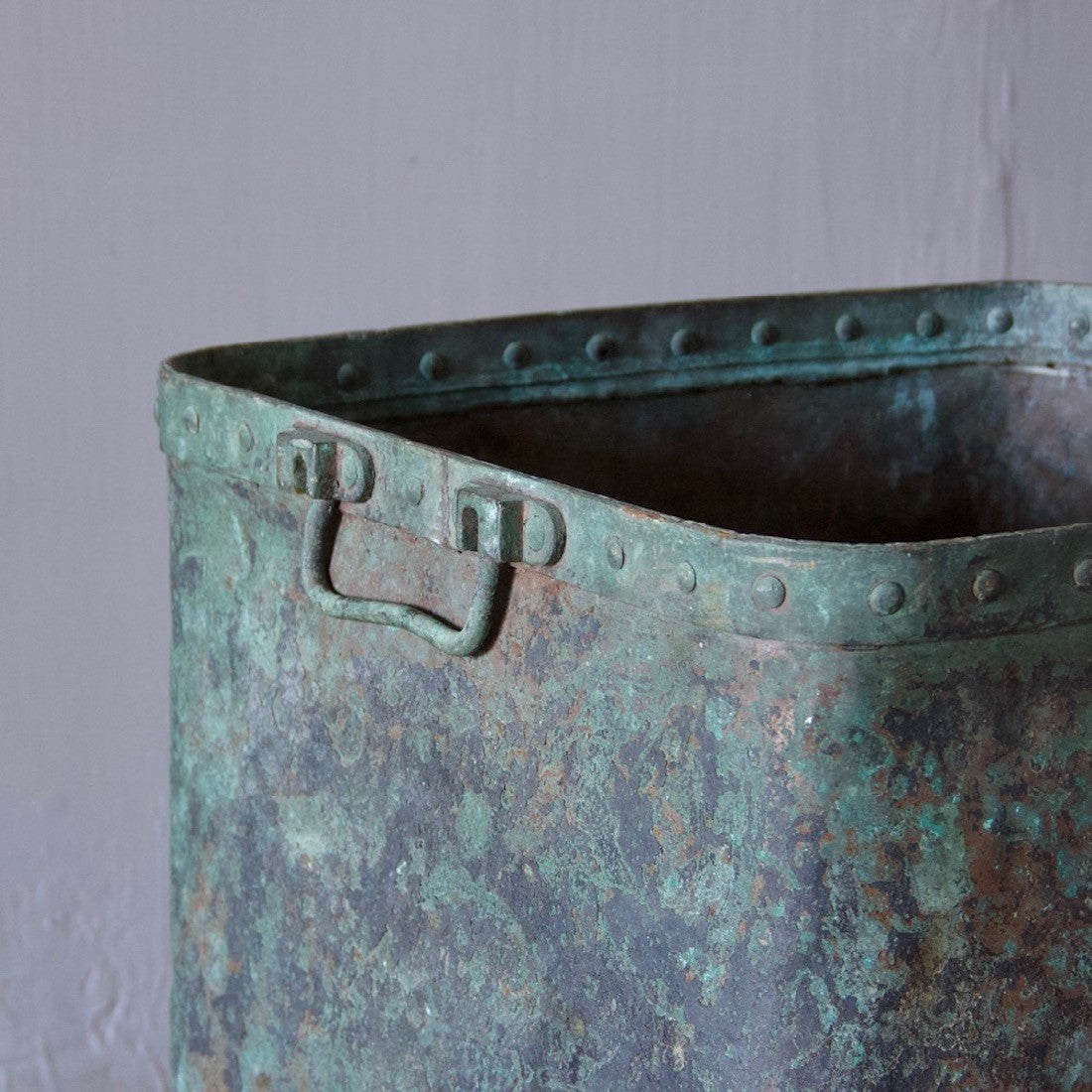 A verdigris copper tub