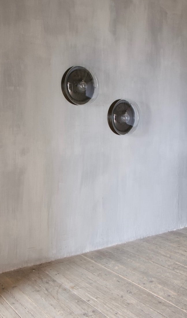 A large pair of glass wall lights
