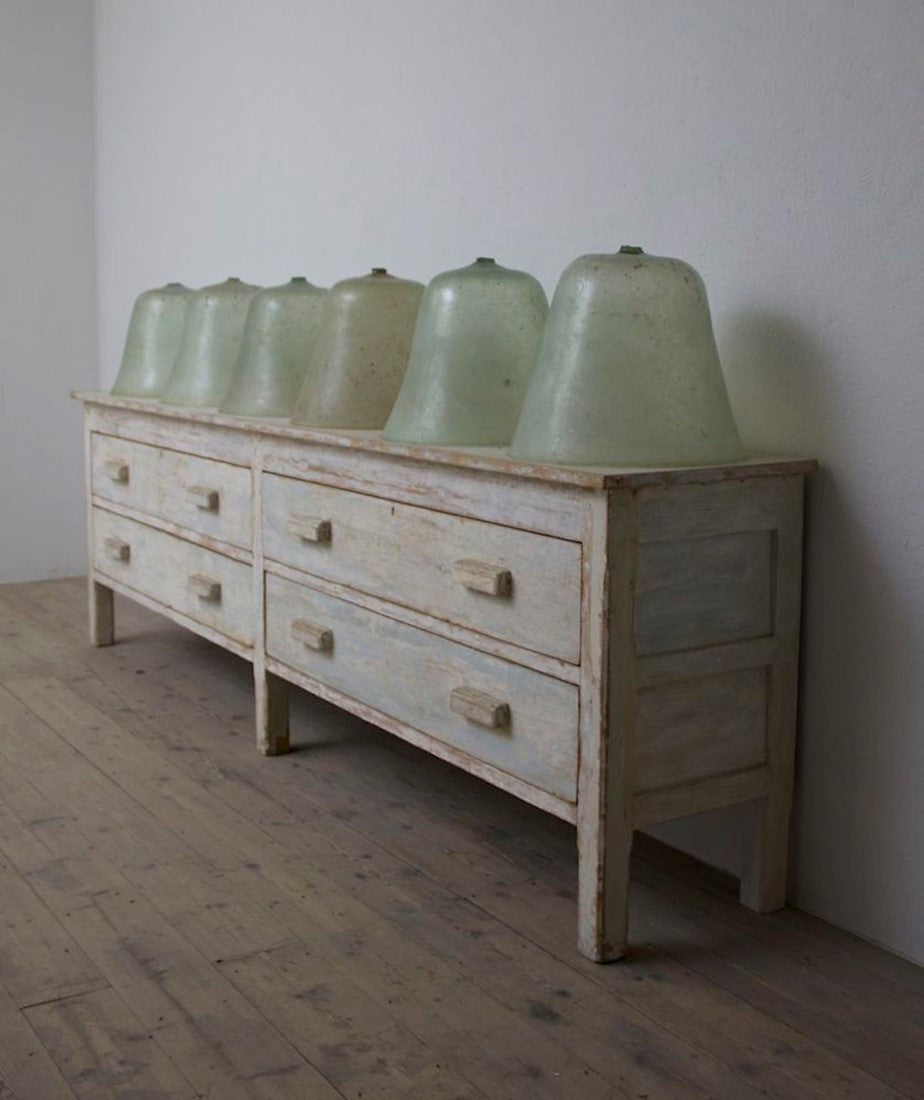 8 large early C20th melon cloches