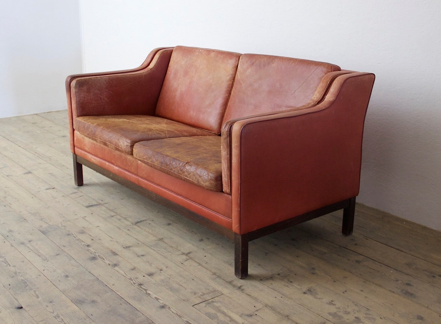 A mid 20th century leather sofa