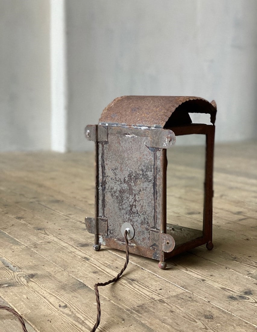 A primitive tole wall lantern