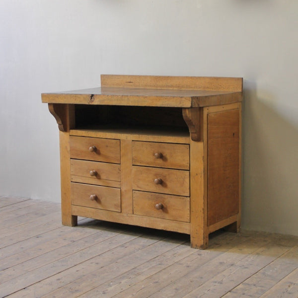 A primitive beech chest of drawers