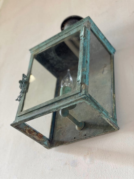 A verdigris bronze wall lantern