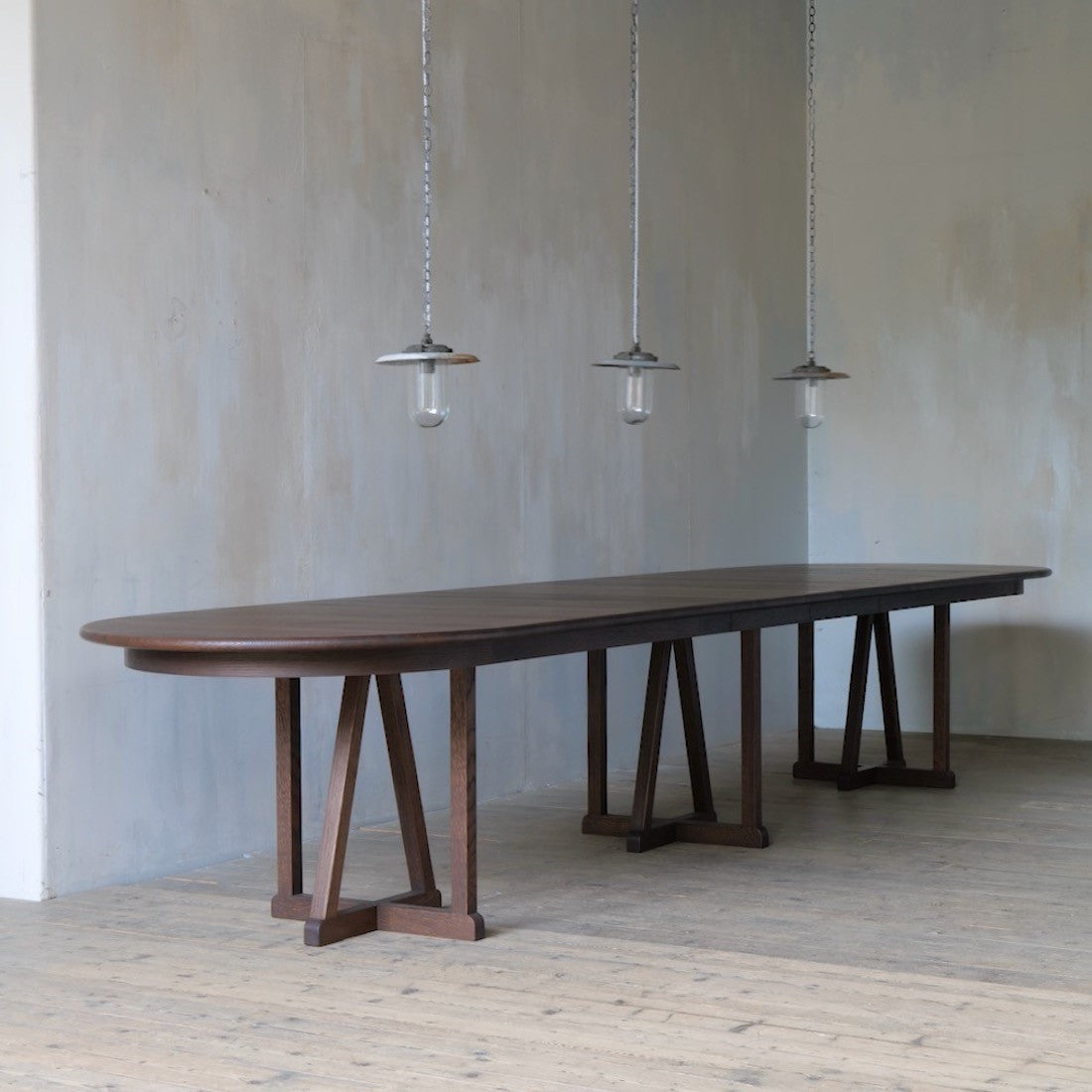 A set of three industrial pendant lights
