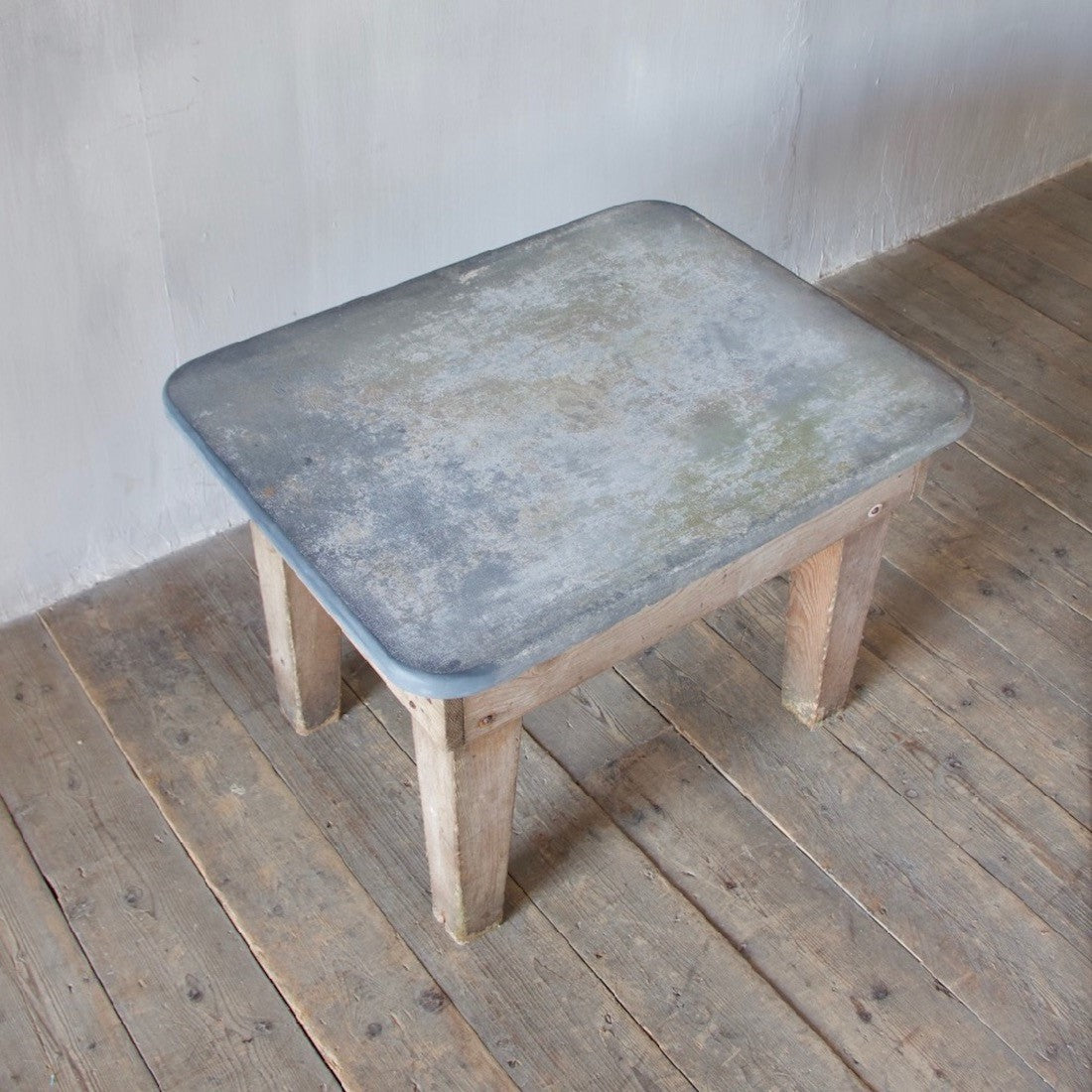 A primitive estate-made side table