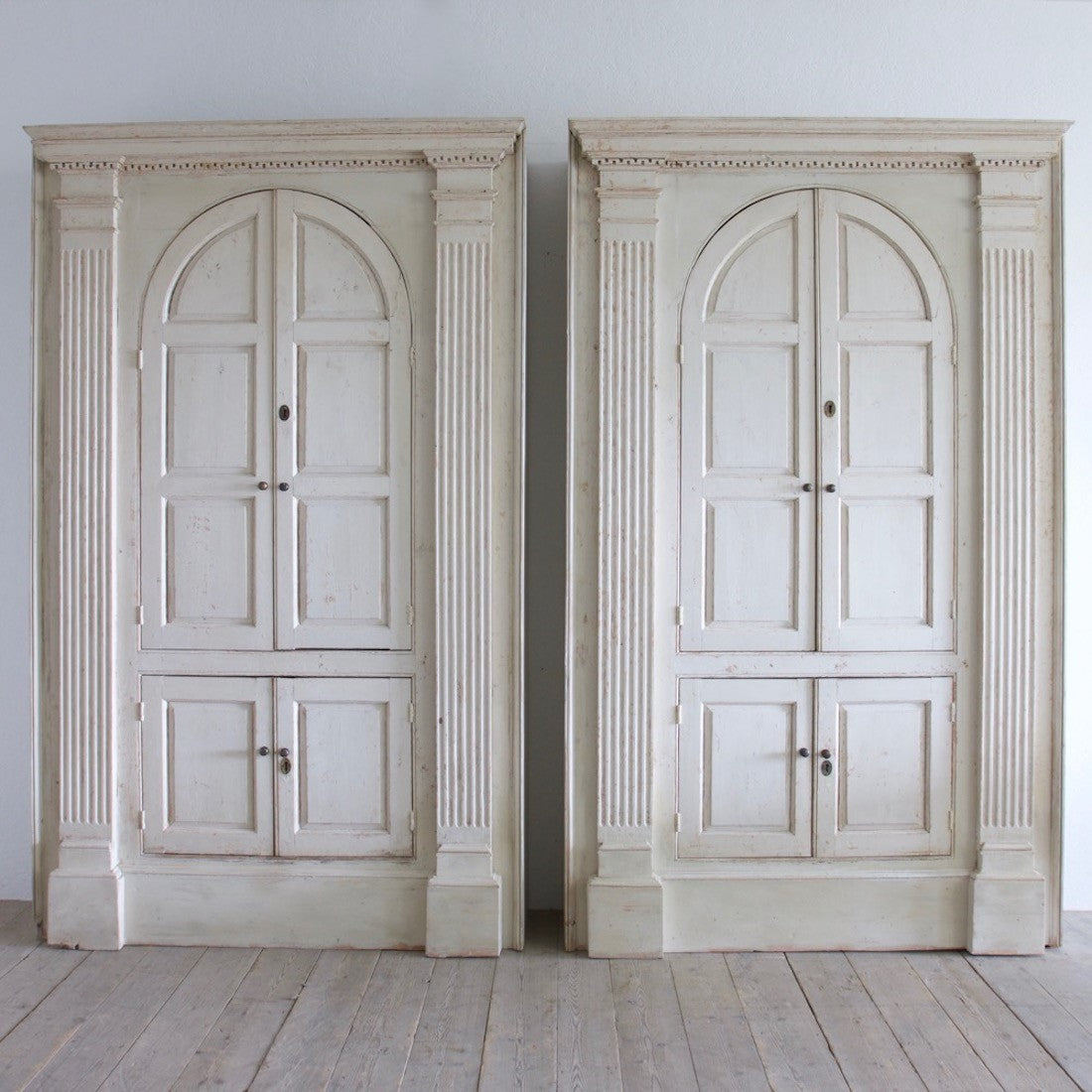 A pair of C18th cupboards