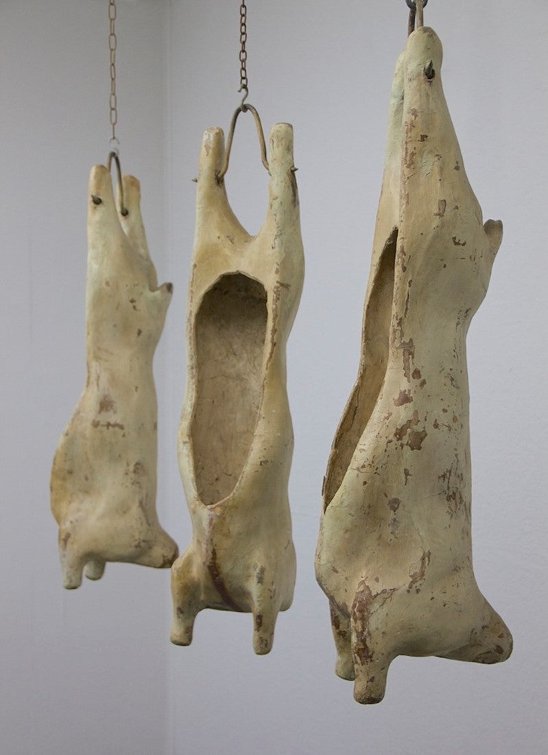 A set of 4 papier-mâché lamb carcasses