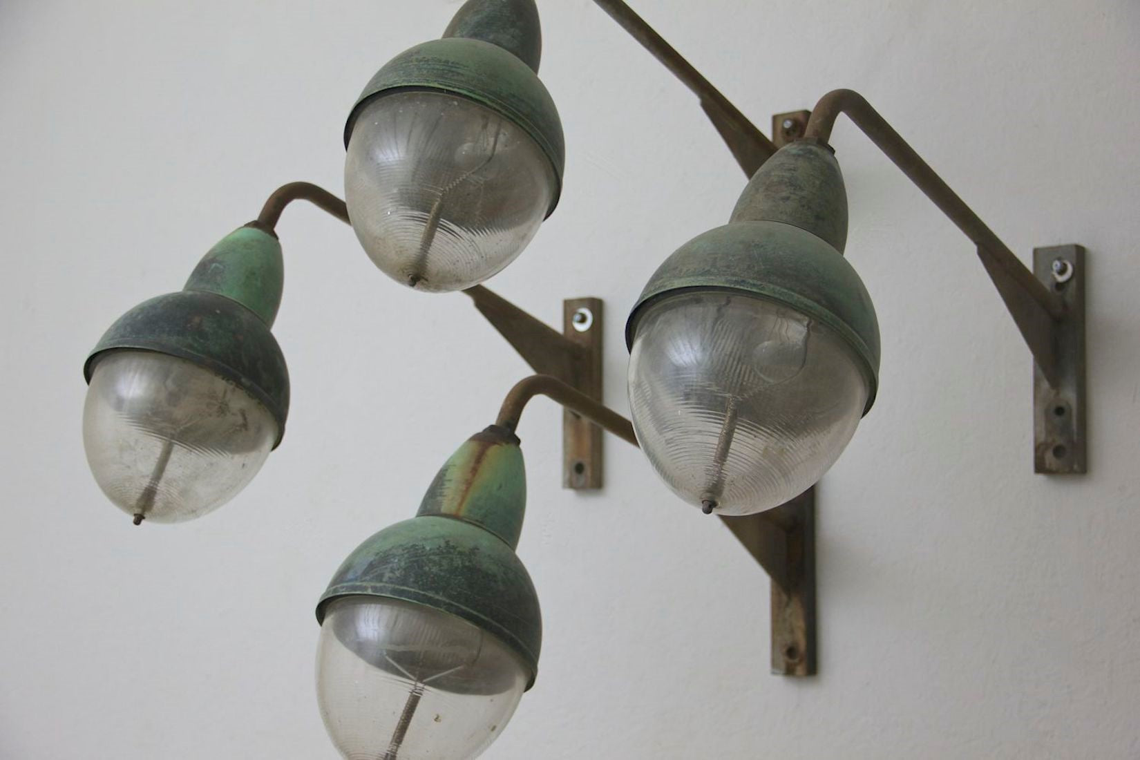 A run of 10 Holophane wall lights