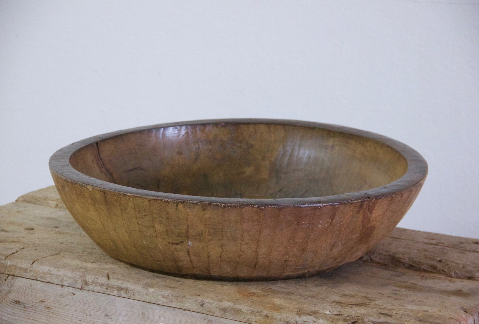 An oversized wooden bowl