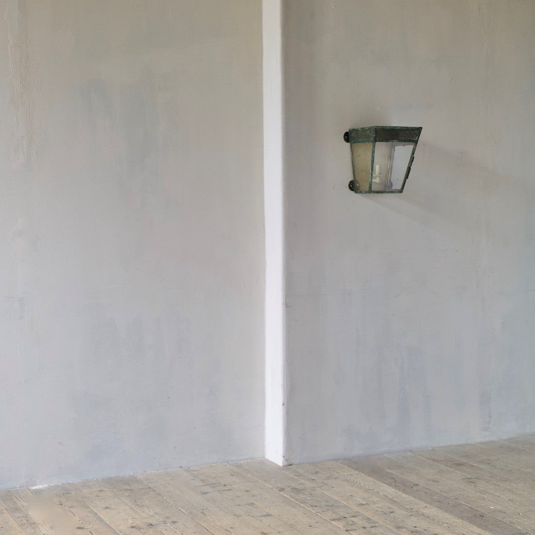 A simple estate-made wall lantern