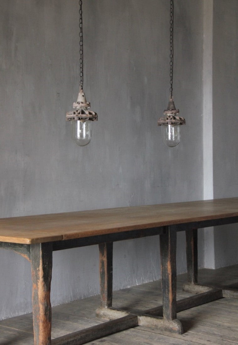 A set of three small industrial pendant lights