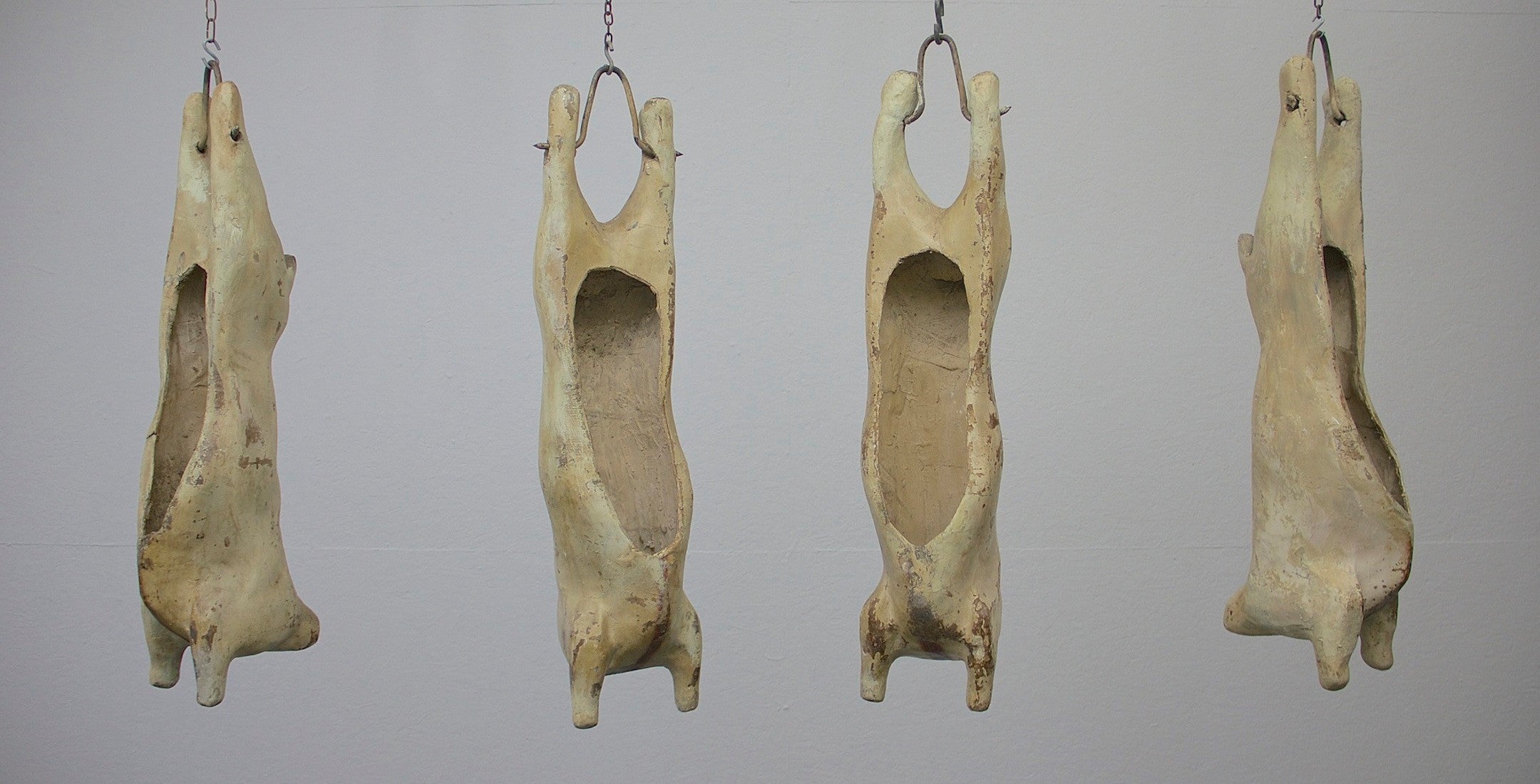 A set of 4 papier-mâché lamb carcasses