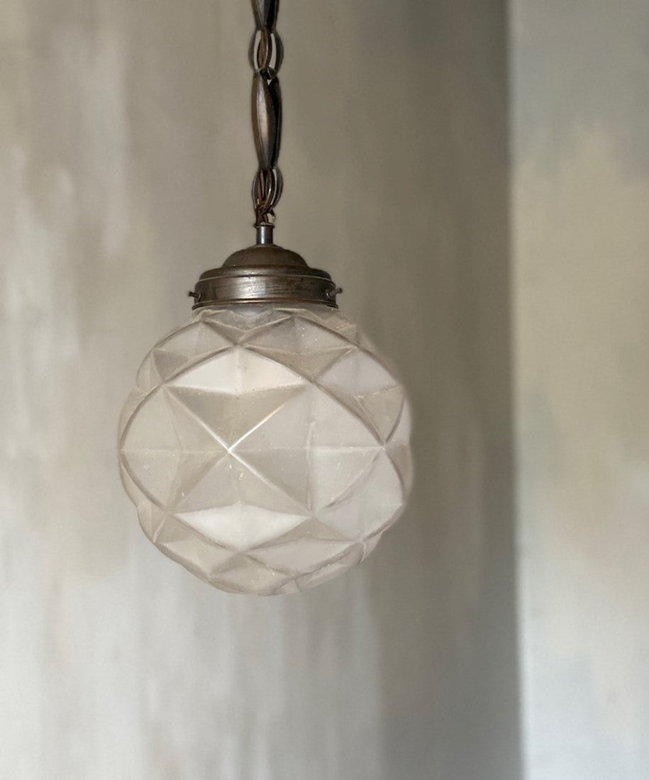 A geometric globe pendant light