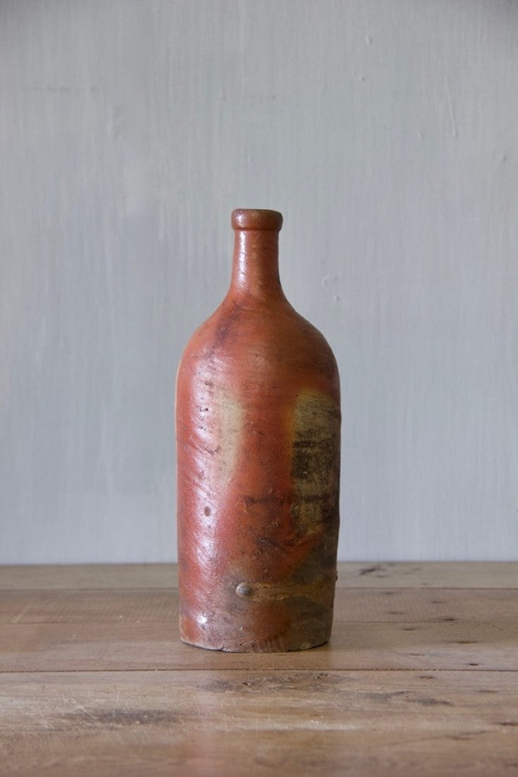 A set of ten clay bottles